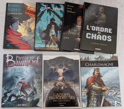 six romans fantastiques français posés sur une surface blanche