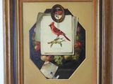 tableau représentant un oiseau rouge perché sur une assiette de fruits