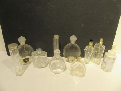 a lot of glass bottles sitting on a table