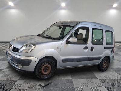 a silver van that is parked on a checkered floor