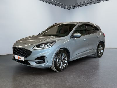 a silver ford kuga parked in a large room