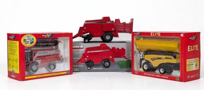 three toy trucks that are sitting in a box