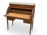 a wooden desk with a glass top and drawers