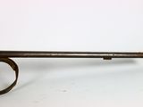 a close up of a gun on a white surface with a white background