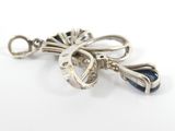 silver and blue crystal bow broochle on a white background