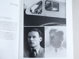 an open book with a picture of a man in a suit and tie