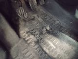 a close up view of a car ' s floor with the brake pedals