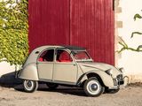 a small car that is parked in front of a red door