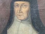painting of a nun in a black robe with a cross in her hand