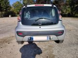 a small car that is parked on the side of the road