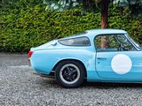 an image of a blue sports car parked in a parking lot