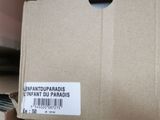 a cardboard box with a label on it sitting on the floor