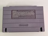 an old nintendo game console sitting on top of a white table