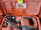 an orange tool case with tools in it sitting on the floor