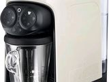 a coffee maker that is sitting on a white surface