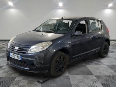 a picture of a small grey car parked in a garage