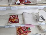 a shelf with a variety of food items on it