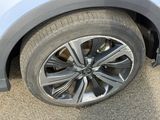 a close up of a car ' s tire on the road