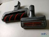 two vacuums that are sitting on a table