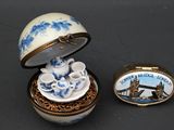 a small box with a tea cup and saucer on it