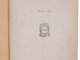 an open book with a drawing of a coat of arms on it