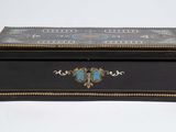 a black box with a blue and gold design on it