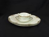 an image of a tea cup and saucer set on a black background