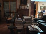 a room with a lot of books on the floor