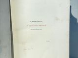two open books sitting on a white surface