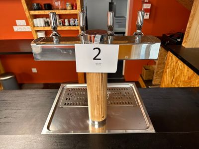 une photo d'un robinet à bière sur lequel figure le chiffre 2