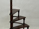 an image of a three tiered wooden shelf