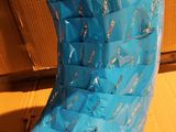 a large piece of blue plastic wrapped in plastic