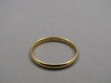 a close up of a gold ring on a table