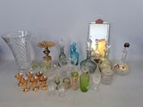a lot of glass items that are sitting on a table
