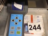 a box with a remote control and a box with other items