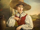 portrait of a young girl in a straw hat holding a red book