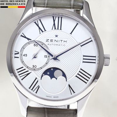 an image of a close up of a wrist watch with roman numerals