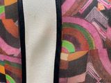 a close up of a colorful bag on a mannequin mannequin mannequin mannequin mannequin mannequin mannequin