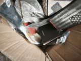 a box full of items that are sitting on a couch