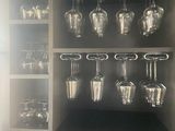 a wine glass rack with wine glasses on it