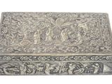 a silver box that is sitting on a white surface