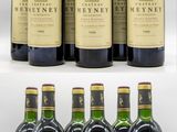 several bottles of wine are lined up on a shelf
