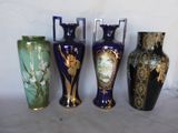 three vases are sitting side by side on a white surface