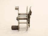 an image of a fishing reel on a white surface
