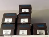 several boxes are stacked on top of each other on a shelf