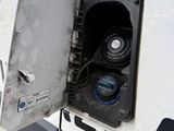 a close up of a gas pump in the back of a truck