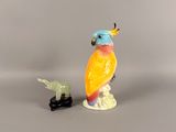 a figurine of a parrot and a turtle on a table