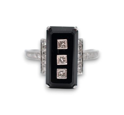 an image of a black and white stone ring with diamonds