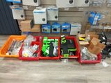 many boxes of assorted electronics on the floor