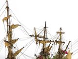 a model of a pirate ship on display on a table